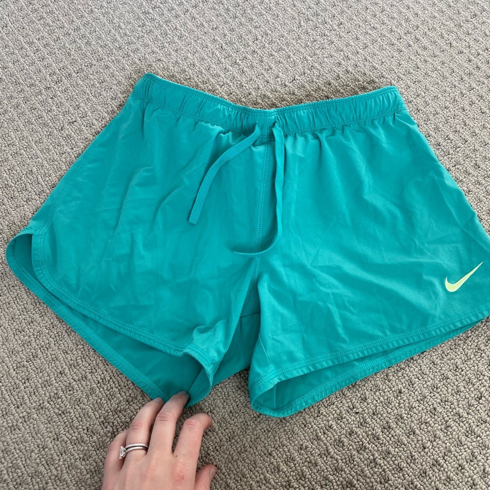 Turquoise Nike shorts with build in spandex